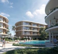Wohnungsbau in Surat Thani mit abgerundeten Gebäuden und einem Pool in der Mitte des Komplexes.