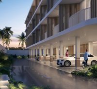 Wohnungsbau in Surat Thani: Parken unter einem modernen Gebäude, umgeben von tropischem Grün.