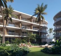 Wohnungsbau in Surat Thani: Wohngebäude mit Palmen und Grün im Hintergrund.