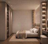 Schlafzimmer mit Bett und Holzboden in einem Ferienapartment.