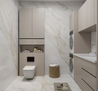 Ein Badezimmer in einem Einfamilienhaus mit Waschmaschine, Schrank und Marmorverkleidung.