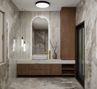 Ein Badezimmer in einem Einfamilienhaus mit Marmorfliesen und Holzelementen.