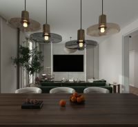 Esszimmer in einem Einfamilienhaus mit Holztisch, Hängelampen und Blick auf das Wohnzimmer.