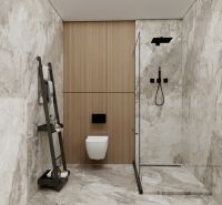 Ein Badezimmer in einem Einfamilienhaus mit Marmorimitat an den Wänden und einer Duschkabine aus Glas.