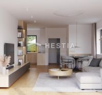 Wohnzimmer eines Einfamilienhauses mit Holzboden, Sofa und Esstisch.