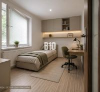 Kinderzimmer in einer 3-Zimmer-Wohnung mit Bett, Schreibtisch und Boden mit Holzdekor.
