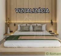 Ein Schlafzimmer in einem Einfamilienhaus mit Holzelementen und einfacher Einrichtung.