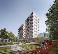 Neubau mit Balkonen, Radfahrer und Straßenbahn auf den Mlynské Nivy in Bratislava-Ružinov.
