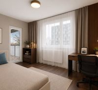Ein geräumiges Zimmer in einer 3-Zimmer-Wohnung mit einem Schreibtisch und einem Boden in Holzoptik.