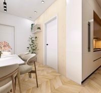 Innenraum einer 2-Zimmer-Wohnung mit Holzboden und elegantem Esstisch.