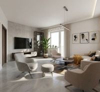 Wohnzimmer in einer 2-Zimmer-Wohnung mit Fernseher, Pflanze und Wandbildern.