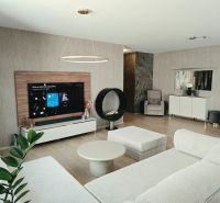 Wohnzimmer in einer 4-Zimmer-Wohnung mit Kamin, Sofa und Holzboden.