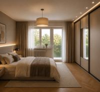 Schlafzimmer in einer 3-Zimmer-Wohnung mit Holzboden und einem bequemen Bett.
