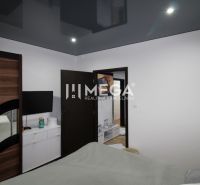 Schlafzimmer in einer 3-Zimmer-Wohnung mit einem dunklen Schrank und einem Fernseher an der Wand.