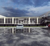 Gewerbeflächen in der Poľná-Straße in Humenné mit Parkplatz vor dem Gebäude.