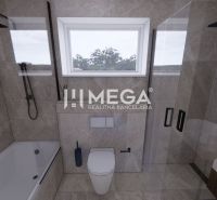 Ein Badezimmer in einem Einfamilienhaus mit moderner Ausstattung, Badewanne und Dusche.