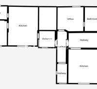 Grundriss eines Einfamilienhauses mit Garage, zwei Küchen und zwei Badezimmern.