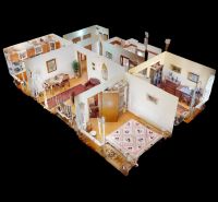 3-Zimmer-Wohnung mit Holzboden und Möbeln im traditionellen Stil.