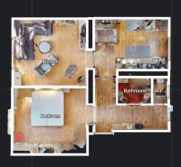 Grundriss einer 2-Zimmer-Wohnung mit Einrichtung und Boden in Holzoptik.