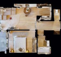 Grundriss einer 2-Zimmer-Wohnung mit Holzbodenoptik, Ansicht von oben.