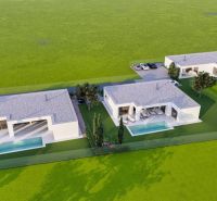 Grundstücke zum Wohnen in Veľké Blahovo bieten moderne Bungalows mit Pools und Grünflächen an.