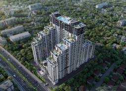 Wohnungsbau in Pattaya, moderner Komplex mit Pools und Grünflächen, umgeben von Natur.