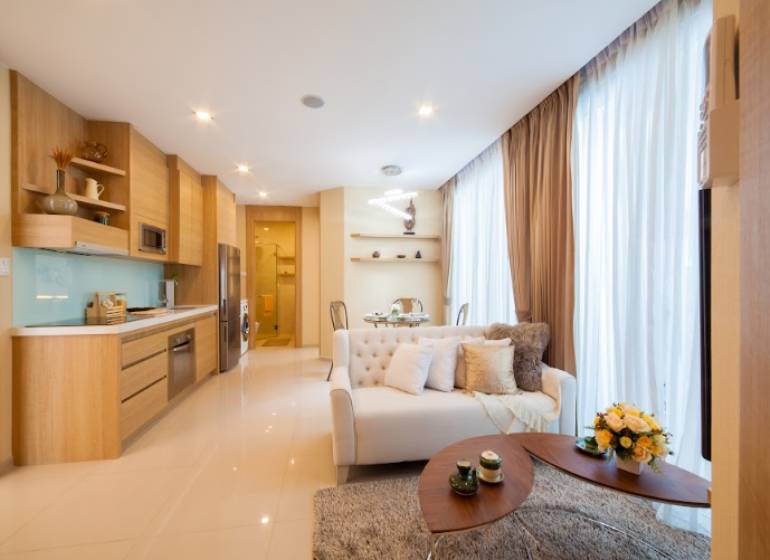 Elegant eingerichtete 3-Zimmer-Wohnung mit offener Küche und gemütlichem Wohnzimmer.