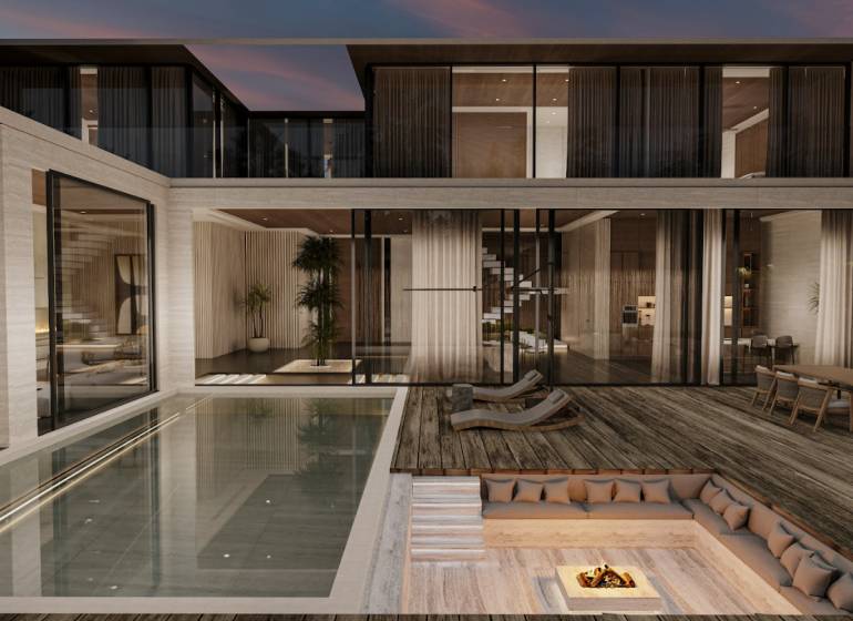 Innenraum eines Einfamilienhauses mit Pool, Terrasse und einer gemütlichen Sitzecke am Feuer.