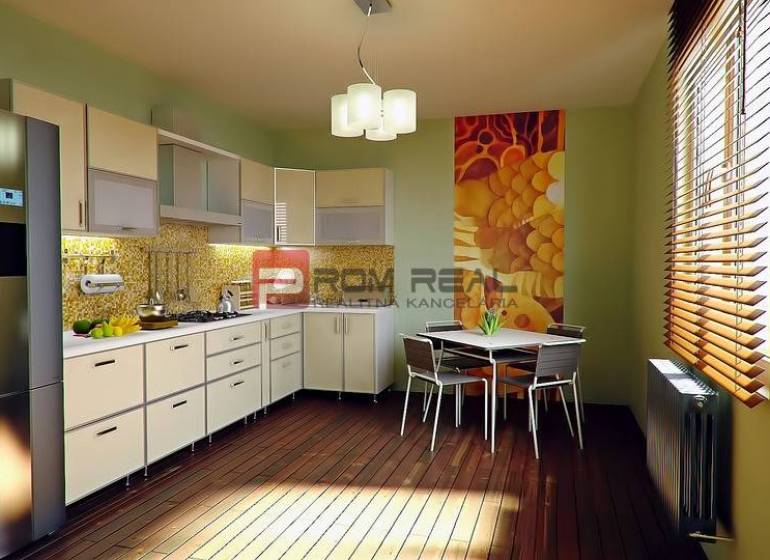 Küche in einer 3-Zimmer-Wohnung mit moderner Küchenzeile, Esstisch und dekorativer Wand.