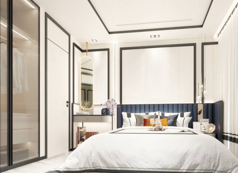 Schlafzimmer in einer 2-Zimmer-Wohnung mit einem großen Bett, einem Schrank und einem Spiegel.
