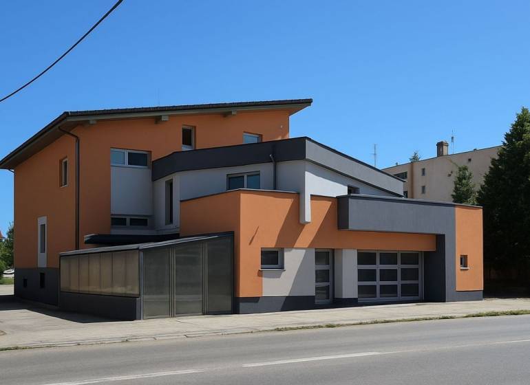 Ein Gebäude in Šaľa mit modernem Design, orange-grauer Fassade und großen Fenstern.