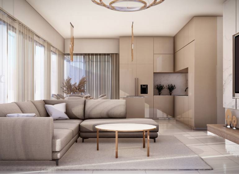Wohnzimmer mit Sofa, Tisch und Küchenzeile in einer 4-Zimmer-Wohnung.
