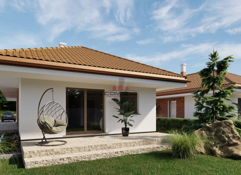 Ein Einfamilienhaus in Veselé mit Terrasse, bequemen Sessel und schönem Garten.