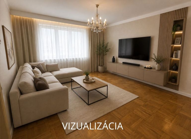 Wohnzimmer mit Ecksofa, Fernseher und Holzboden in einer 2-Zimmer-Wohnung.
