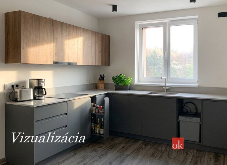 Küche in einer Einzimmerwohnung mit Holzboden und Küchenzeile.