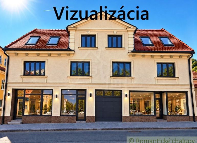 Die Fassade eines Gebäudes mit Geschäftsräumen in der Stadt Modrý Kameň, die verglaste Schaufenster zeigt.