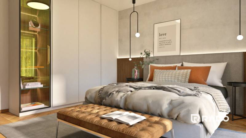 Schlafzimmer in einer 2-Zimmer-Wohnung mit Bett, Schrank und dekorativen Kissen.