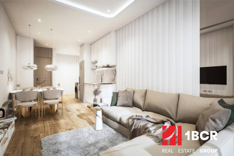 Wohnzimmer mit Küchenzeile, Sofa und Esstisch in einer 3-Zimmer-Wohnung.