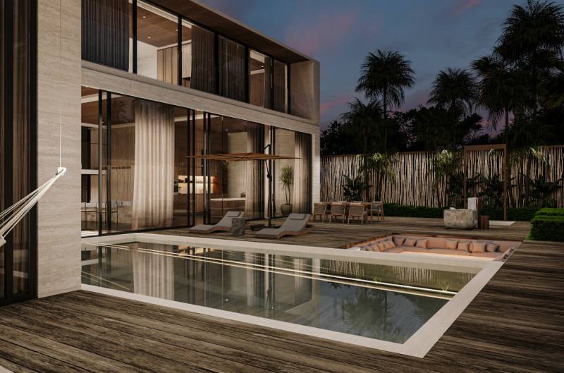 Ein Einfamilienhaus in Nord-Zanzibar mit Pool, Terrasse und verglasten Wänden.