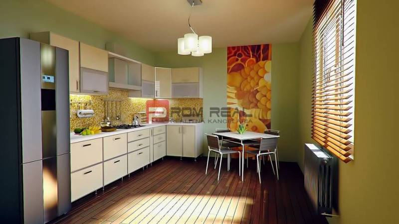 Küche in einer 3-Zimmer-Wohnung mit moderner Küchenzeile, Esstisch und dekorativer Wand.