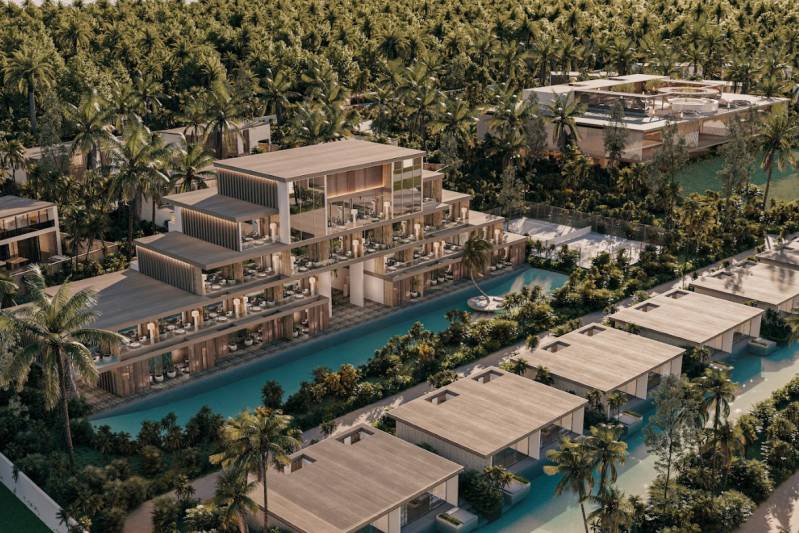 Ein von Palmen, Pools und modernen Gebäuden umgebenes Resort am Stadtrand.