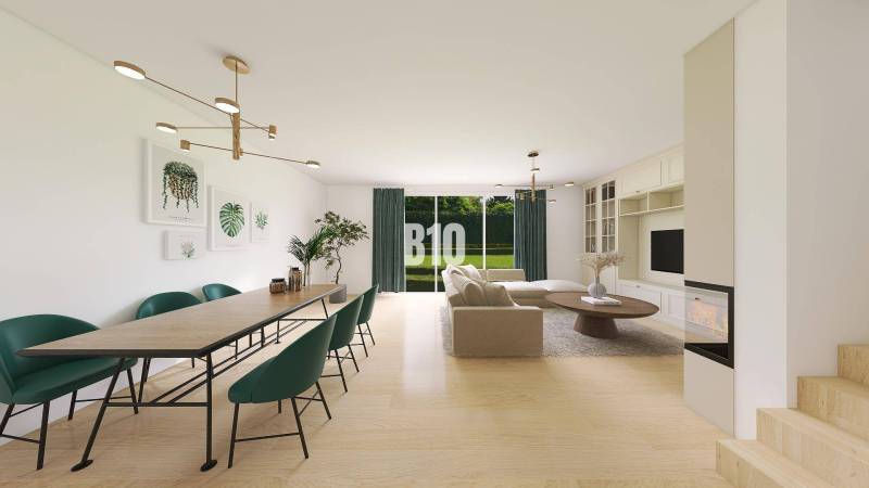 Wohnzimmer und Esszimmer in einem Einfamilienhaus mit Kamin und großem Tisch.