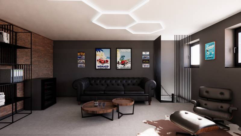 Ledersofa in Geschäftsräumen mit Vintage-Dekorationen an der Wand.