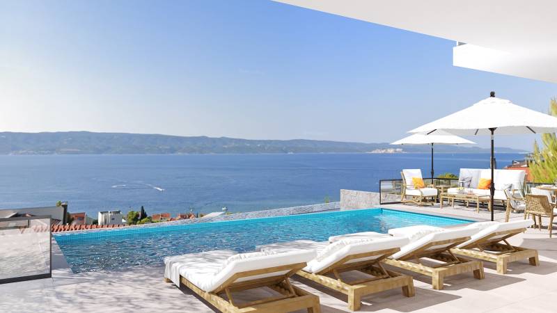 Blick von der Villa in Duće auf das Meer, Terrasse mit Pool, Liegestühlen und Sonnenschirmen.