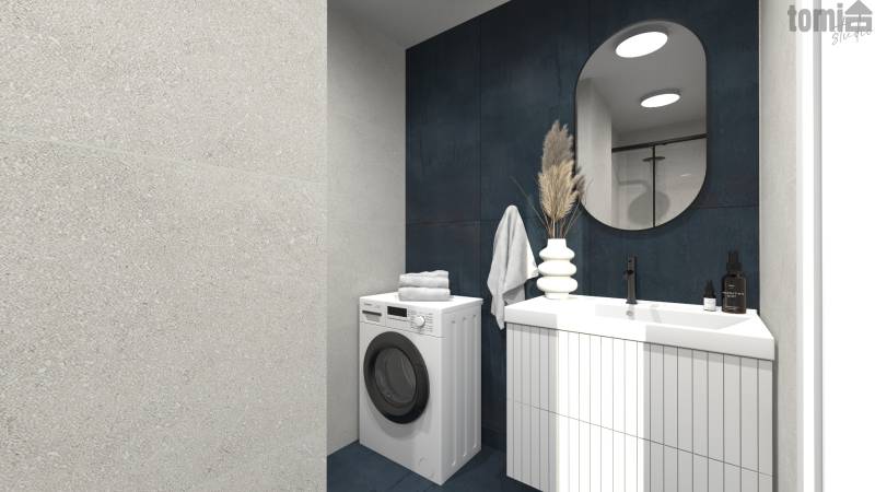 Badezimmer in einer 2-Zimmer-Wohnung mit Waschmaschine, Waschbecken, Spiegel und dekorativen Elementen.