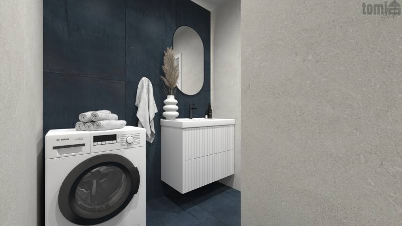 Badezimmer mit Waschmaschine, Waschbecken und dunklen Fliesen in einer 2-Zimmer-Wohnung.