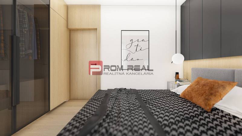Schlafzimmer in einer 2-Zimmer-Wohnung mit Bett, Kleiderschrank und Wanddekoration.