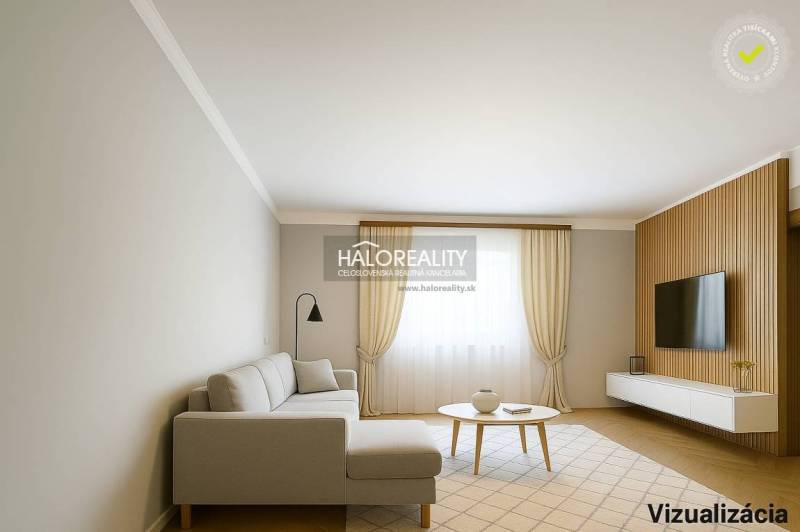 Wohnzimmer in einem Einfamilienhaus mit Holzboden und hellen Möbeln.