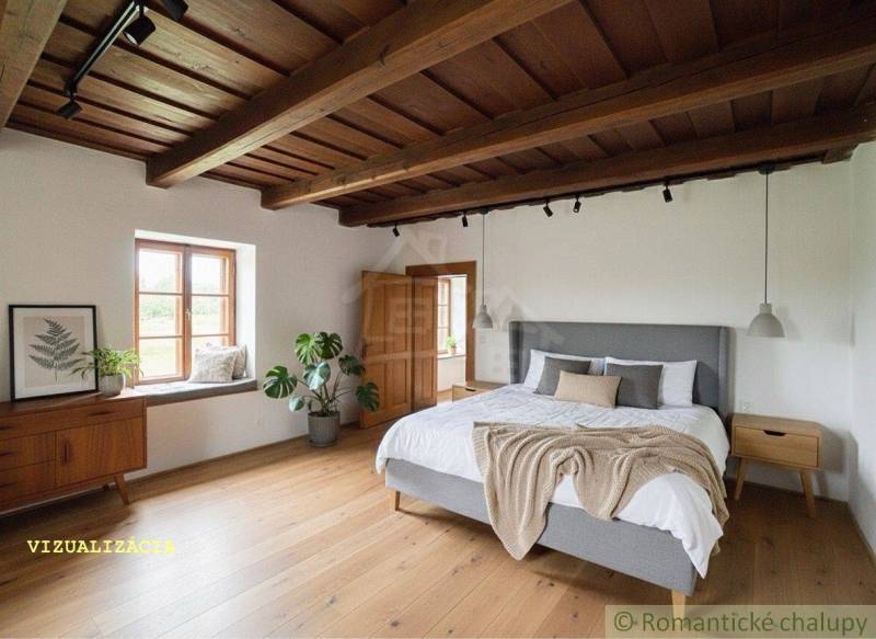 Schlafzimmer in einem Einfamilienhaus mit Holzboden, Pflanzen und einem großen Bett.