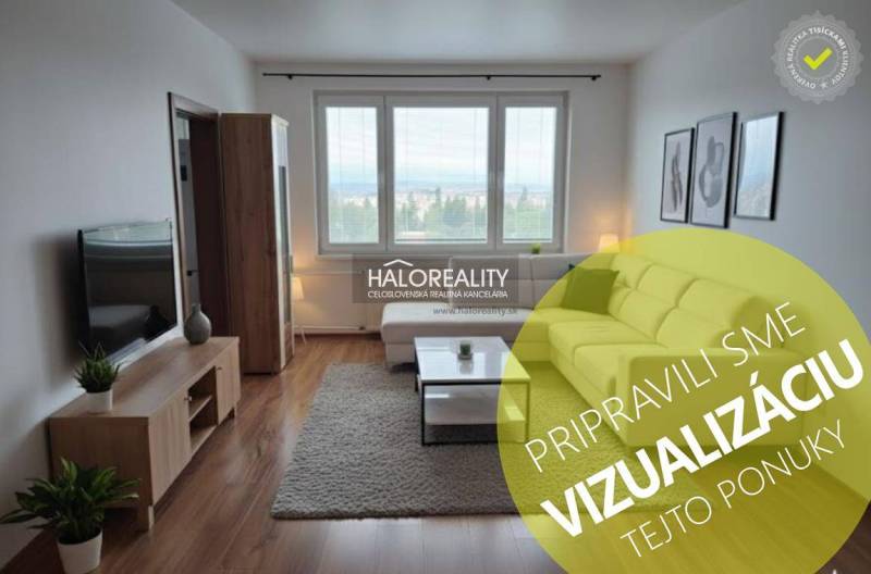 Wohnzimmer in einer 3-Zimmer-Wohnung mit Holzboden und großen Fenstern.